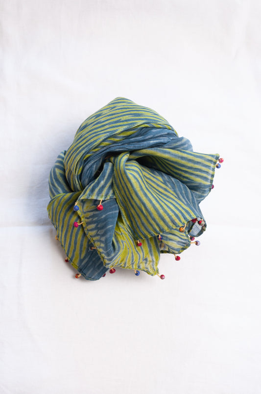 Neeru Kumar shibori dyed cotton silk scarf in blue and green with fabric beads.