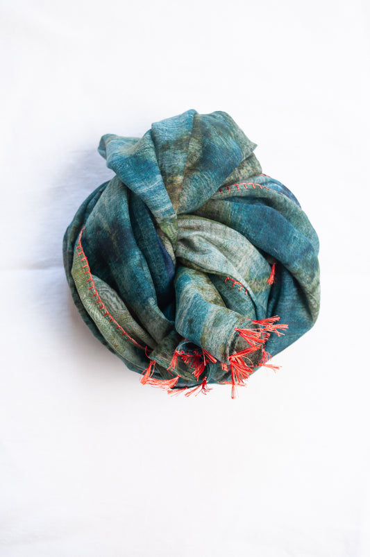 Neeru Kumar cotton silk scarf in blue and green with embroidered edging and tiny tassels.