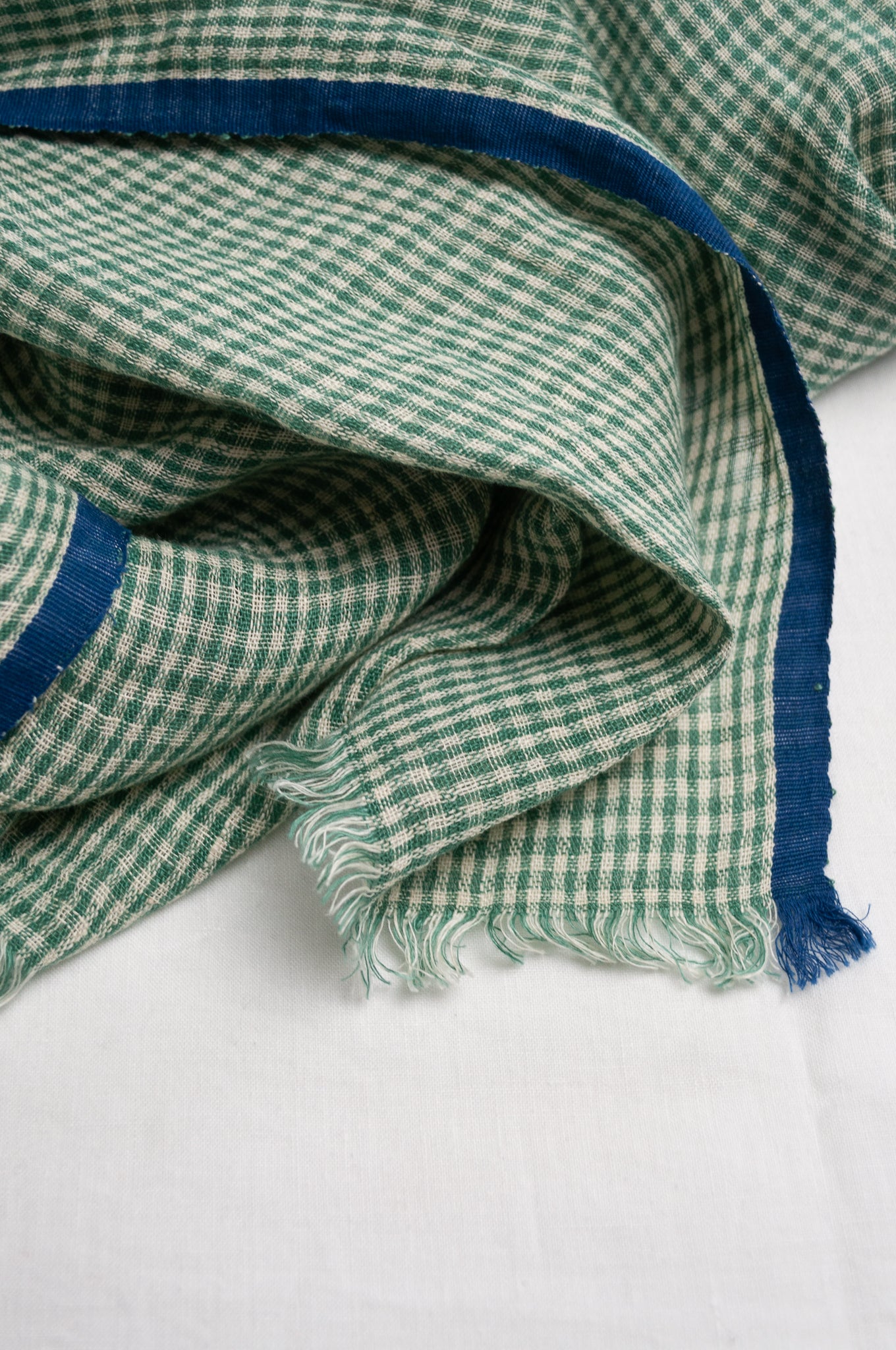 DVE handloom linen scarf in emerald green and white check.