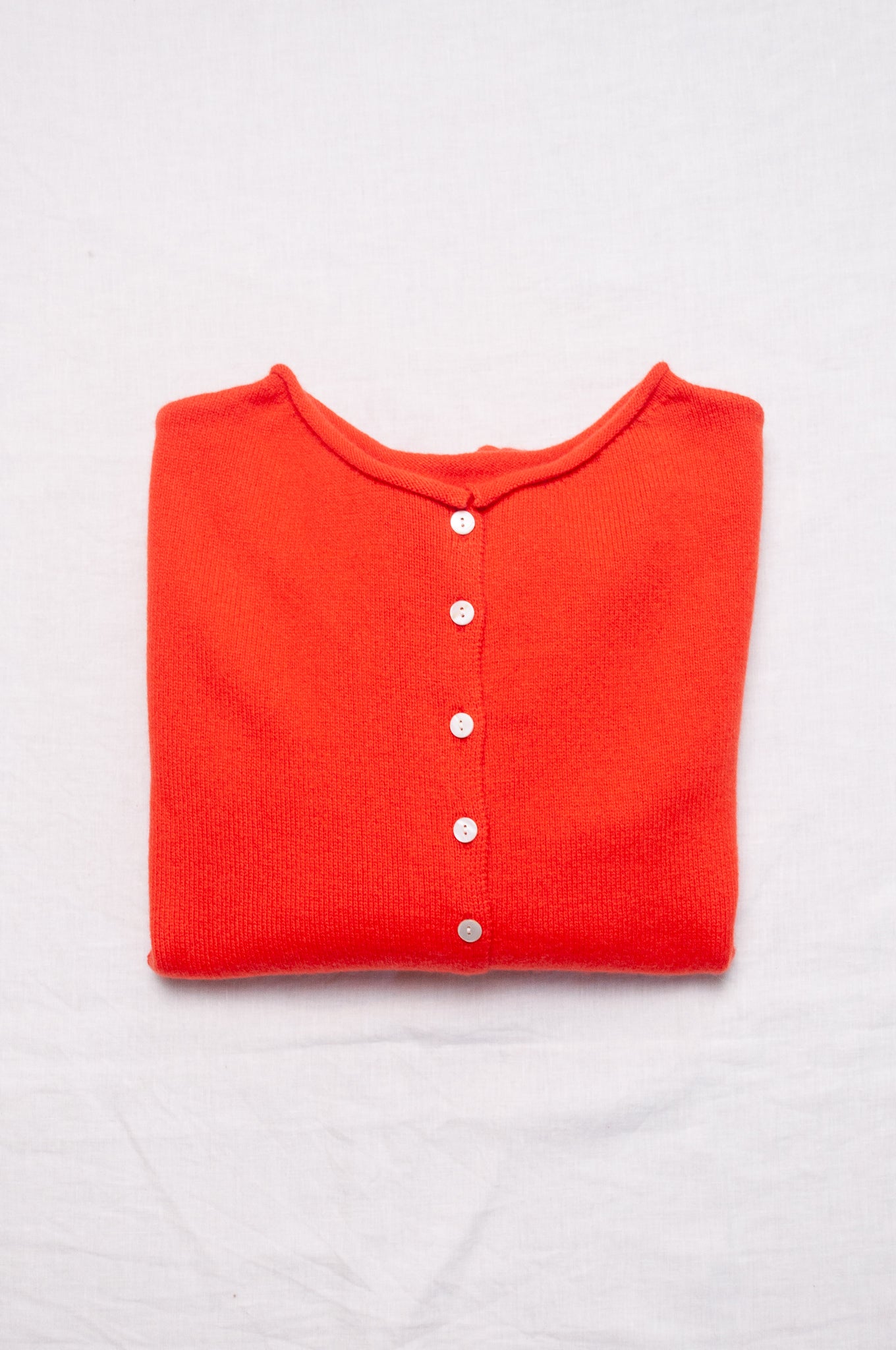 One size reversible cashmere cardigan in tangerine red orange.