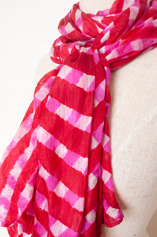 Hand painted pure silk scarf with deep red and pink checks on white.