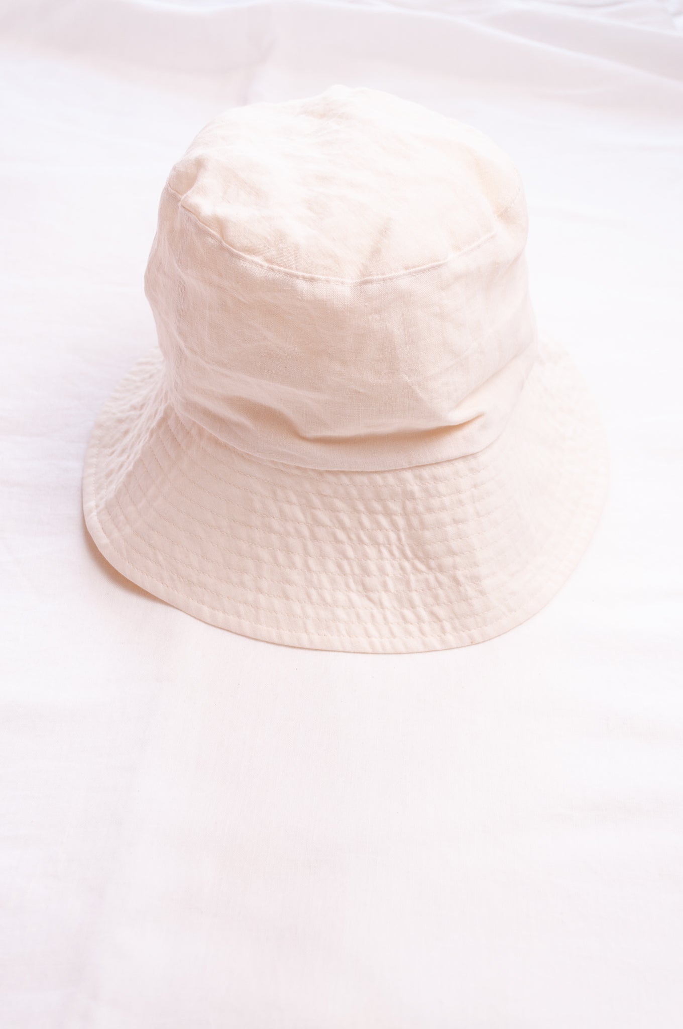 PCNQ Luna made in Japan ivory white foldable linen fabric bucket hat.