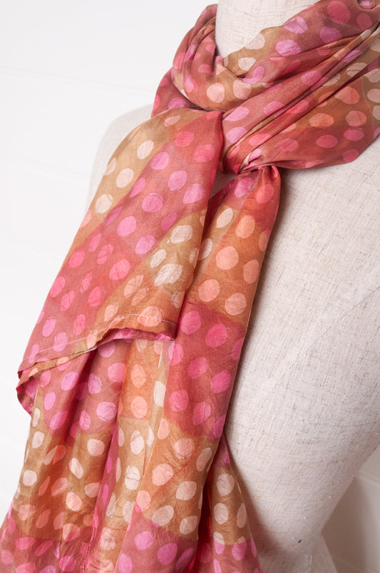 Pure silk shibori dyed scarf in bands of pink and golden brown.