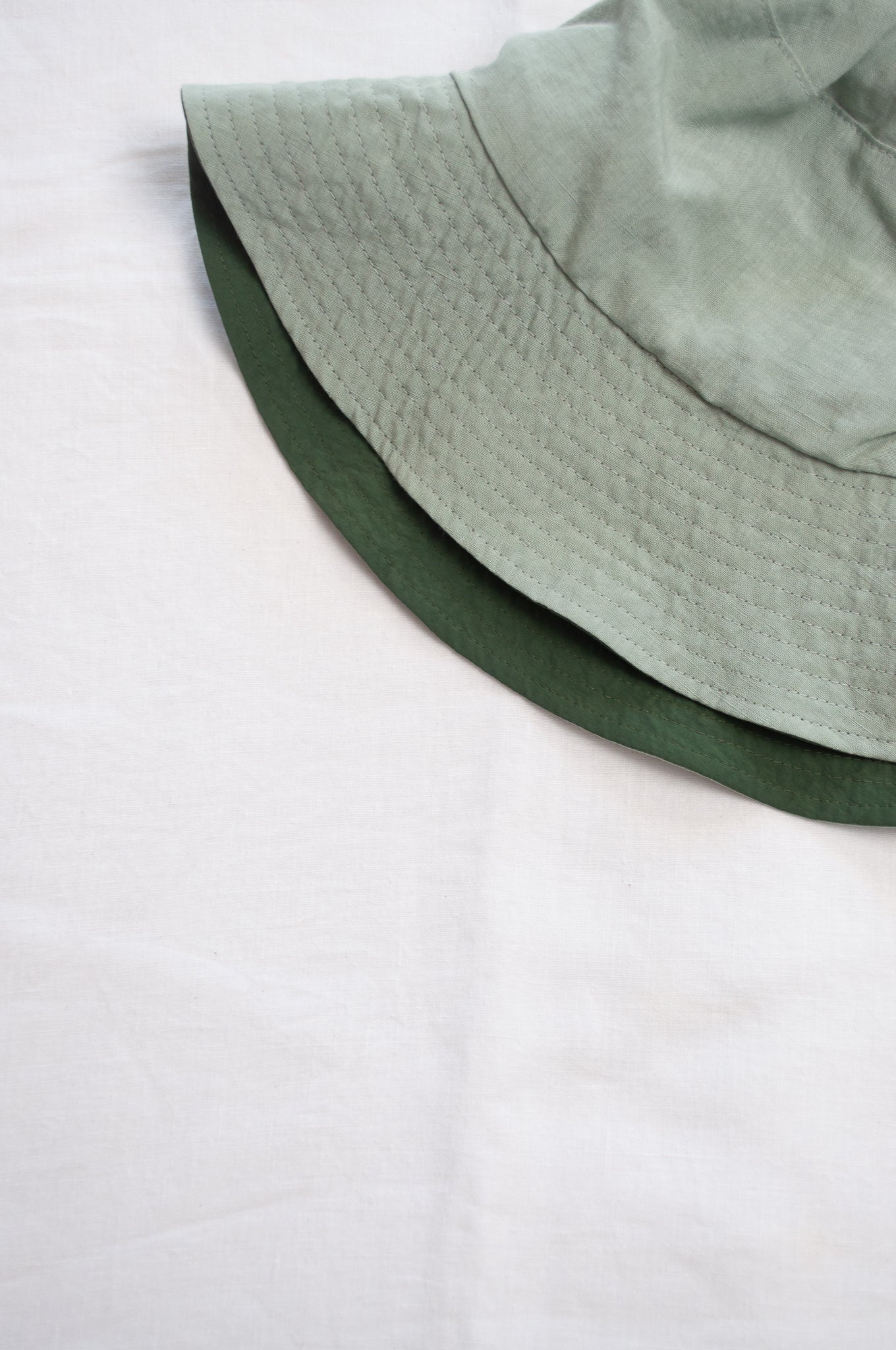 PCNQ Luna made in Japan mint green foldable linen fabric bucket hat.