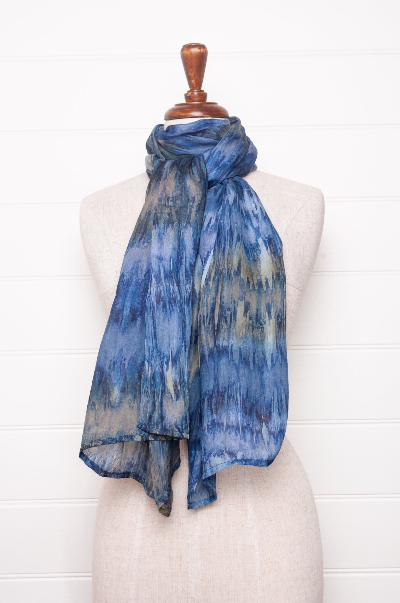 Pure silk shibori dyed scarf in shades of denim blue.