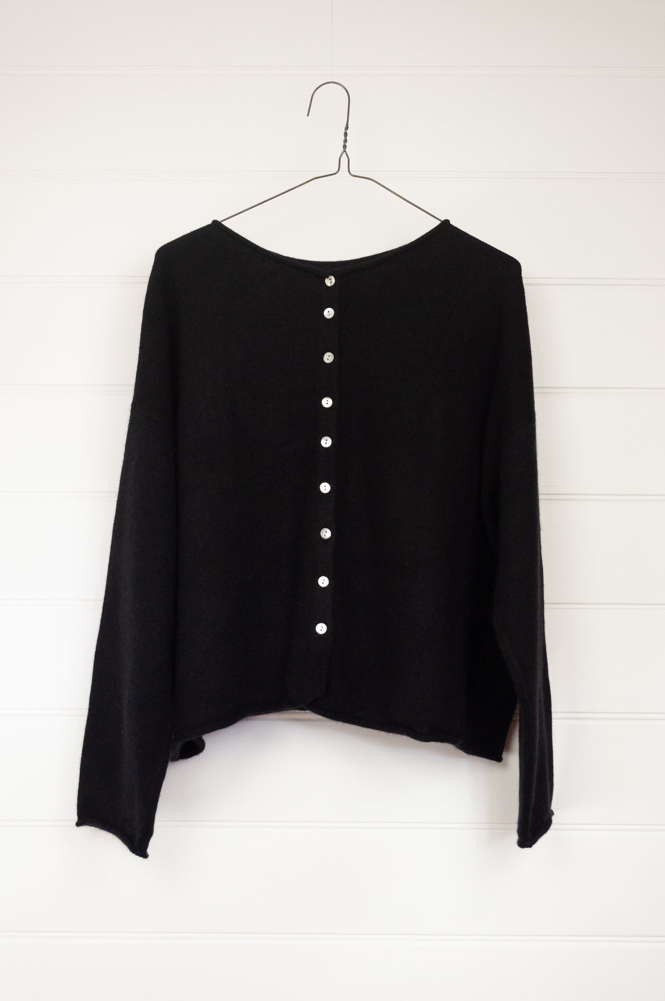 One size reversible cashmere cardigan in black.