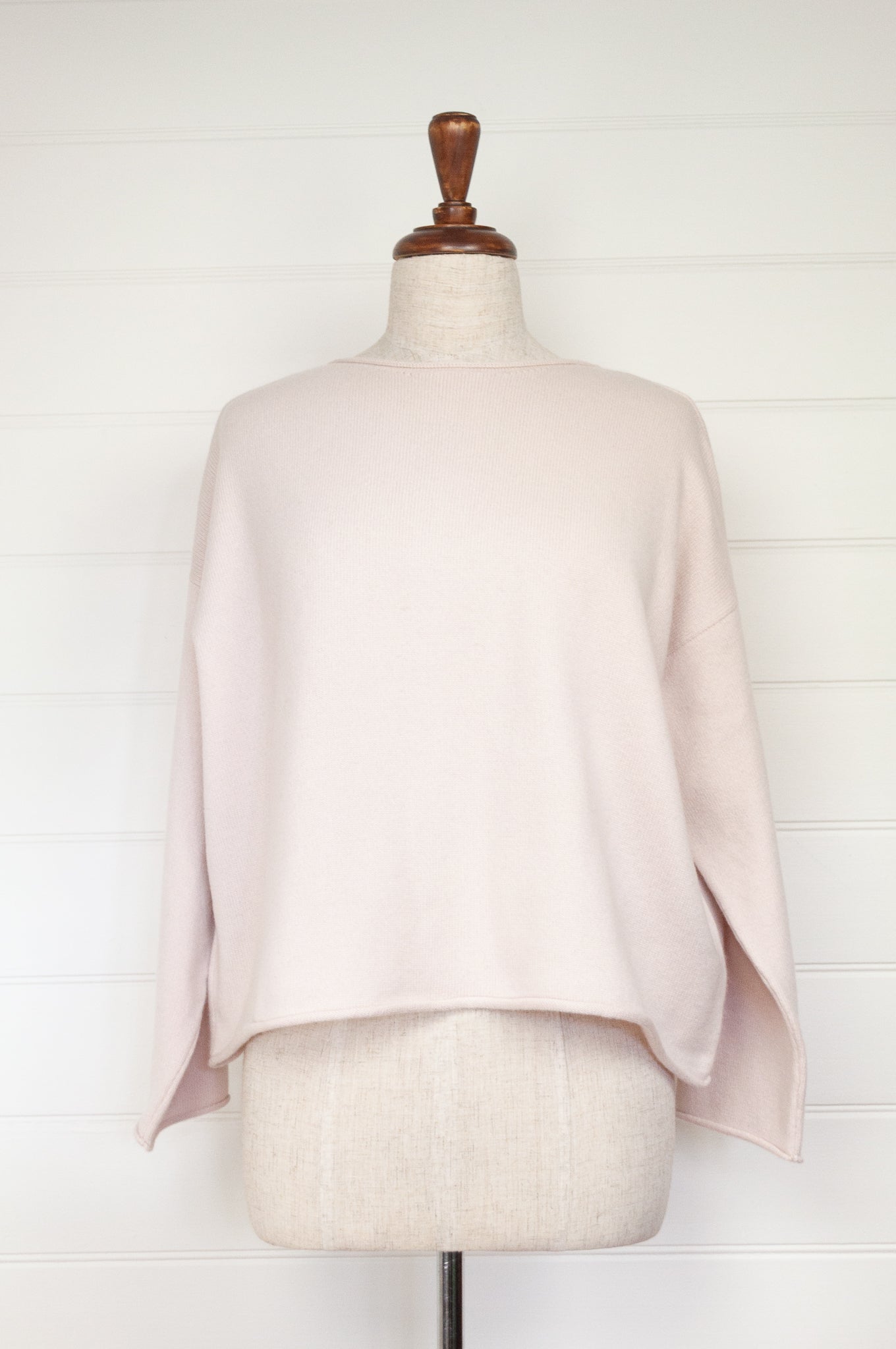 Reversible ecru cashmere cardigan on mannequin.