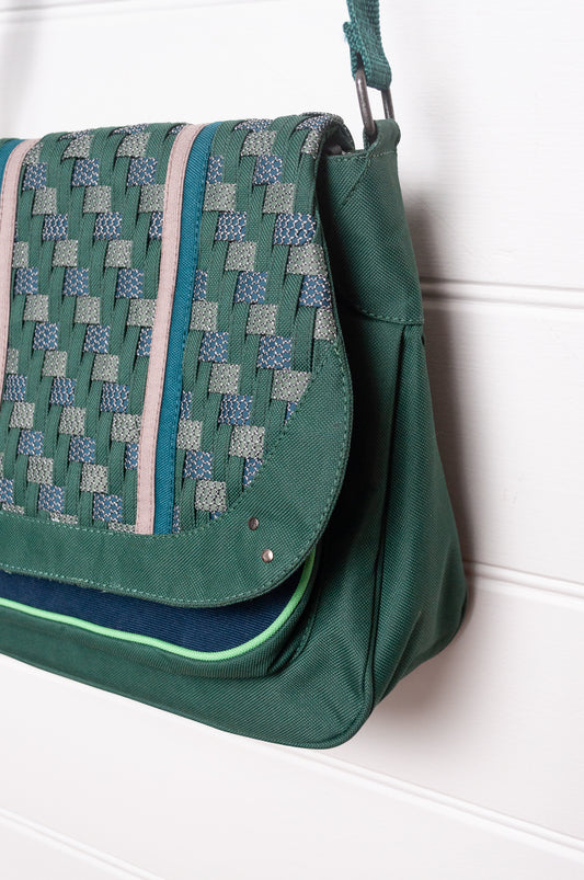 Anna Kaszer Ionza shoulder cross body bag in forest green with woven braid panel.