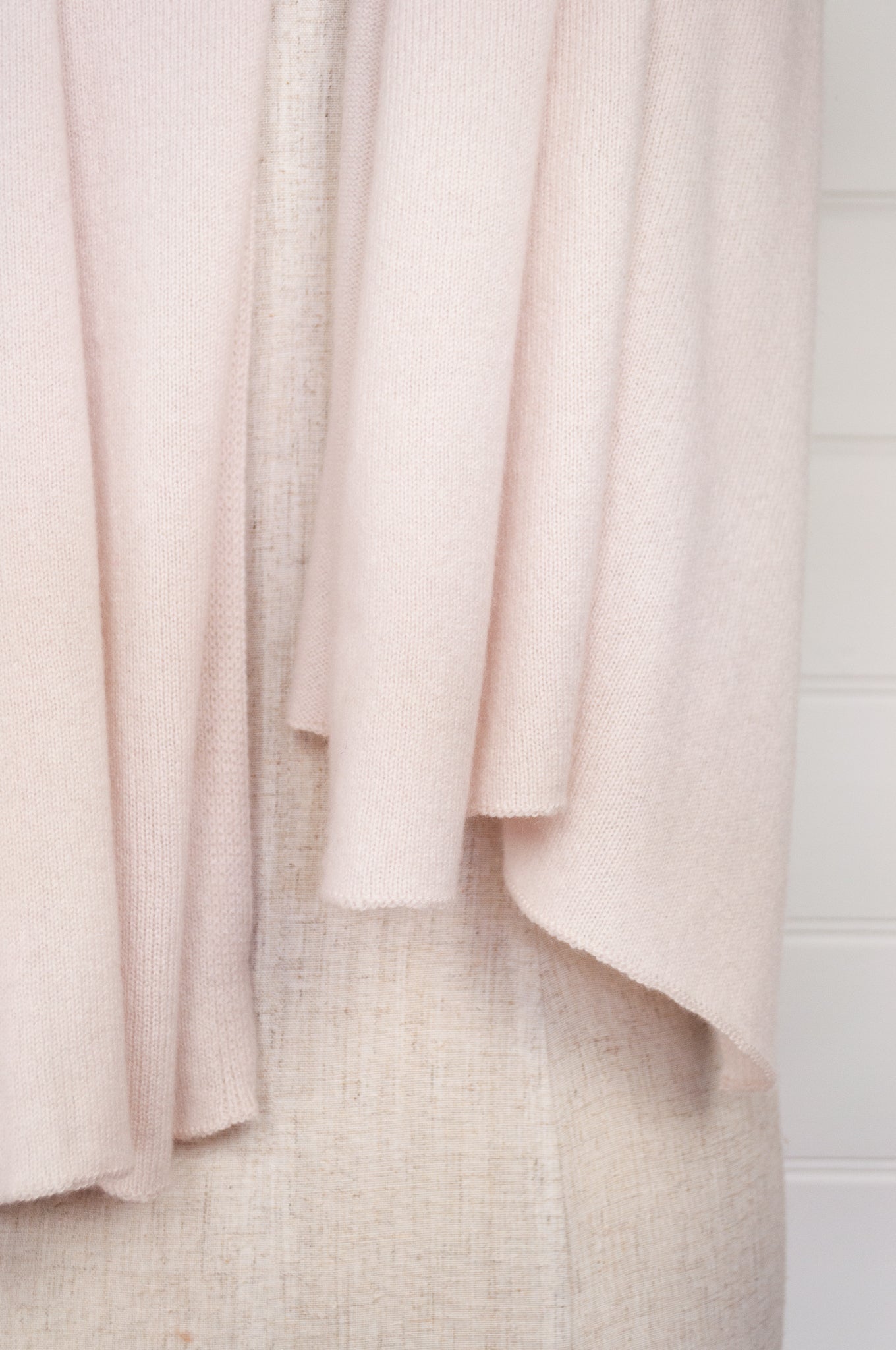 Detail of ecru cashmere knitted scarf.