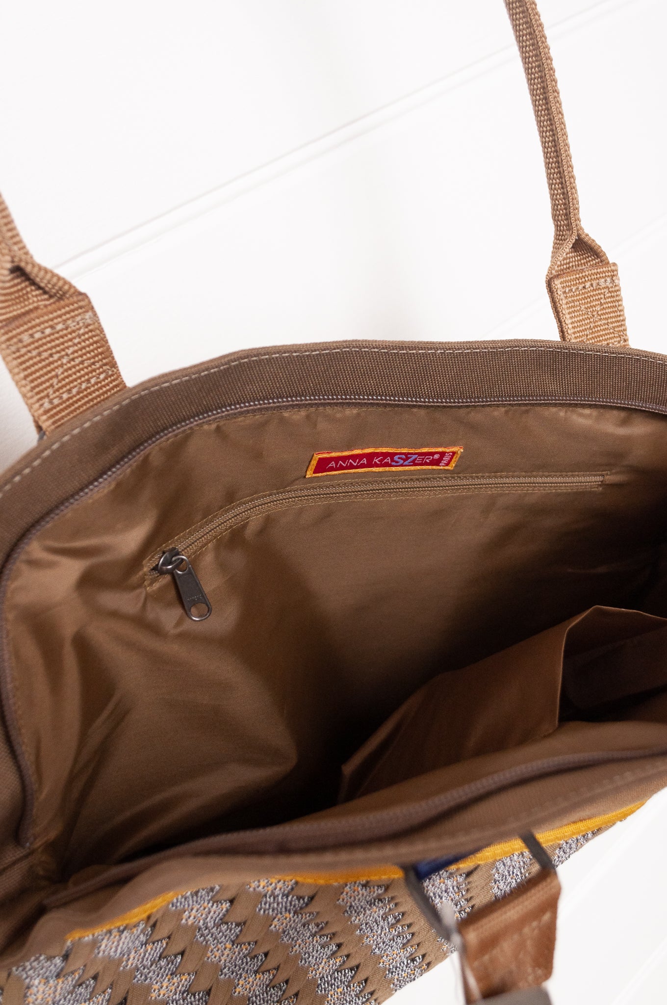 Anna Kaszer Fox bag in taupe, with double shoulder straps and woven braid panel.