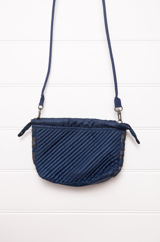 Anna Kaszer quilted Oko drawstring small bag in deep navy Night blue, with woven braid panel.