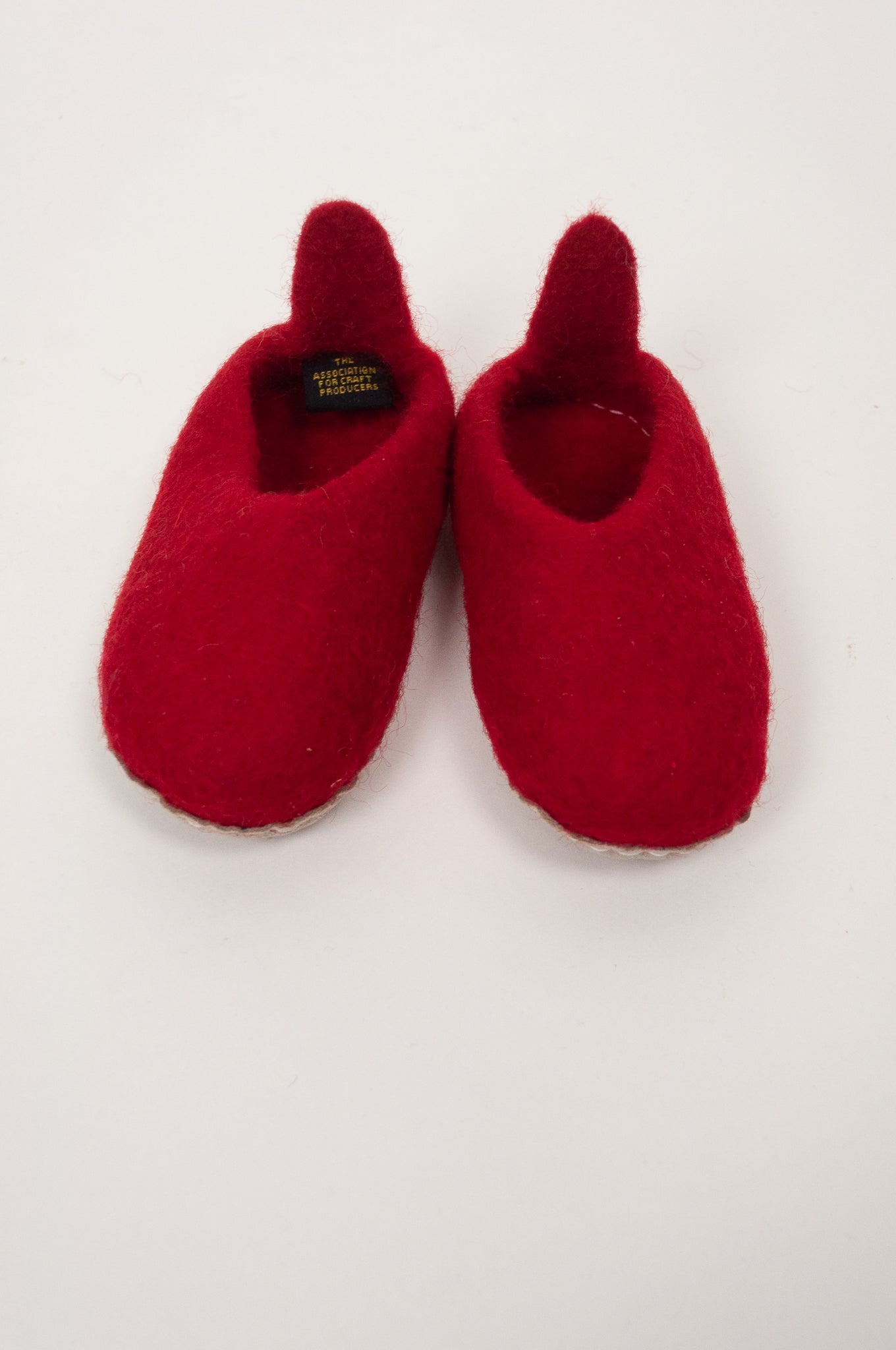 Wool felt baby slippers in crimson red.