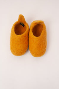 Wool felt baby slippers in mustard yellow.