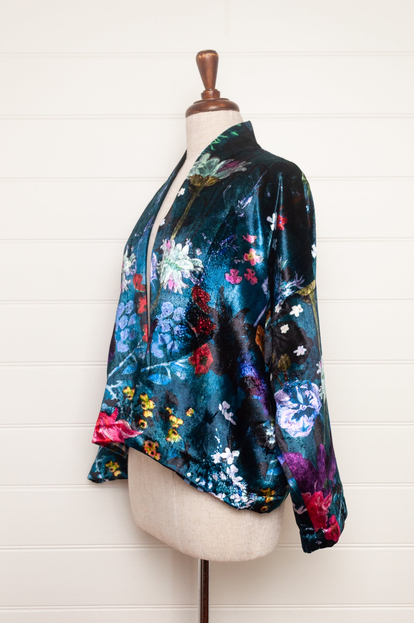 Yavi silk velvet kimono crop jacket in vibrant floral print on teal blue.