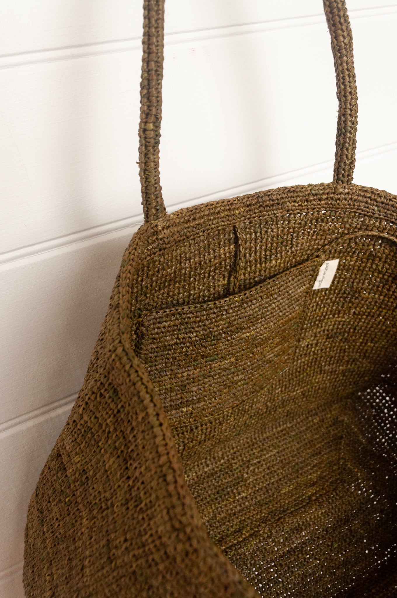 Sophie Digard large sized crocheted raffia bag in Ossido deep olive green.