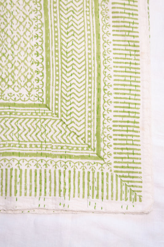 Cotton kantha quilt in lime green and white small floral.