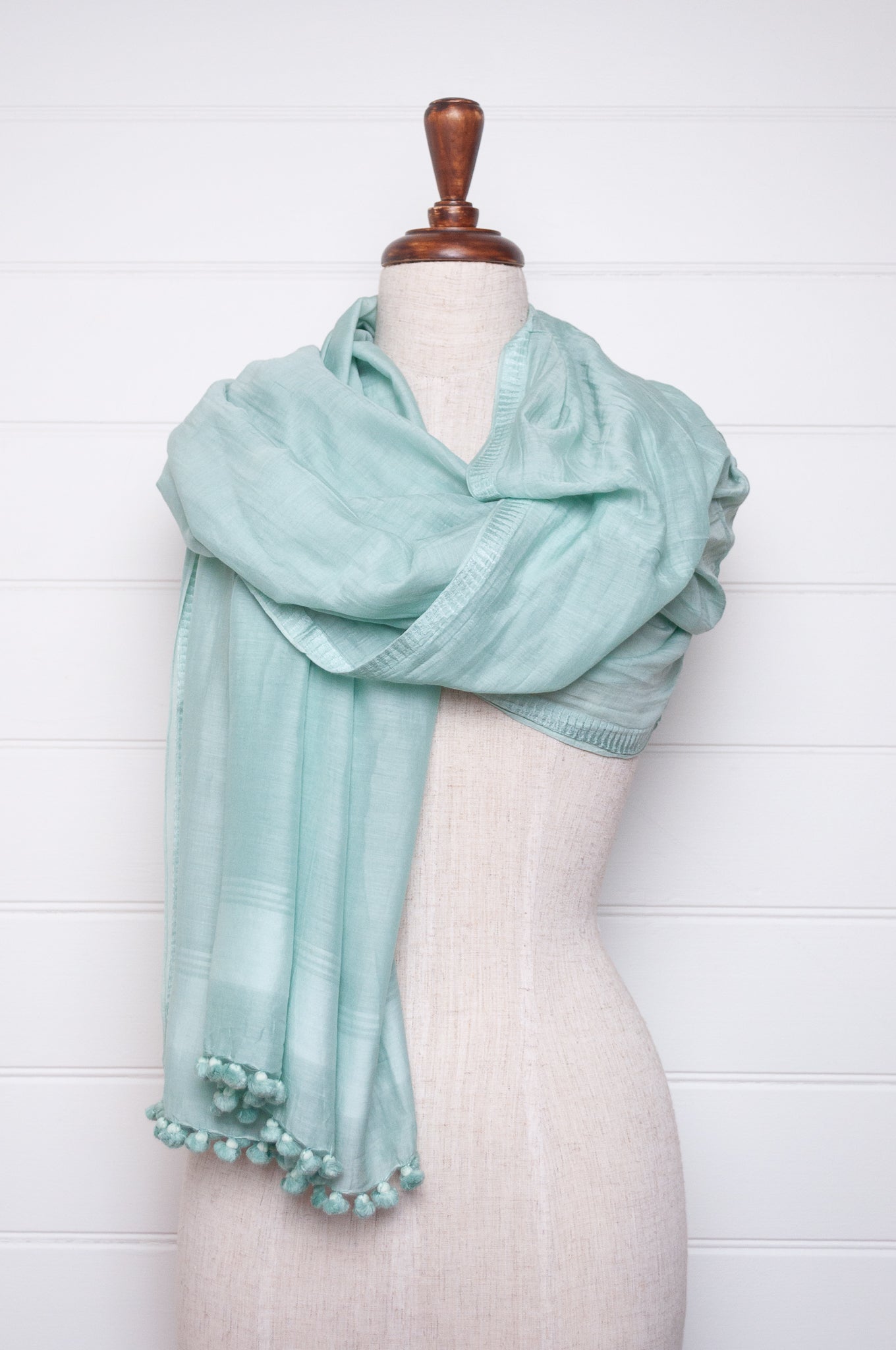 Silk cotton pom pom scarf in aquamarine.