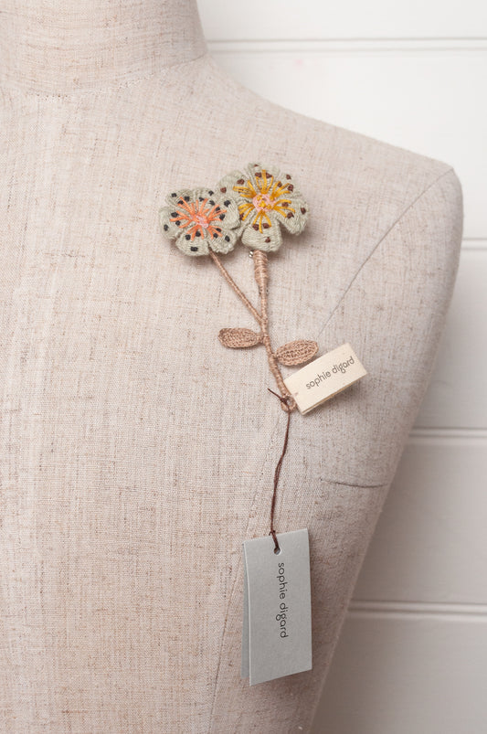 Sophie Digard two flower brooch in pale blue.