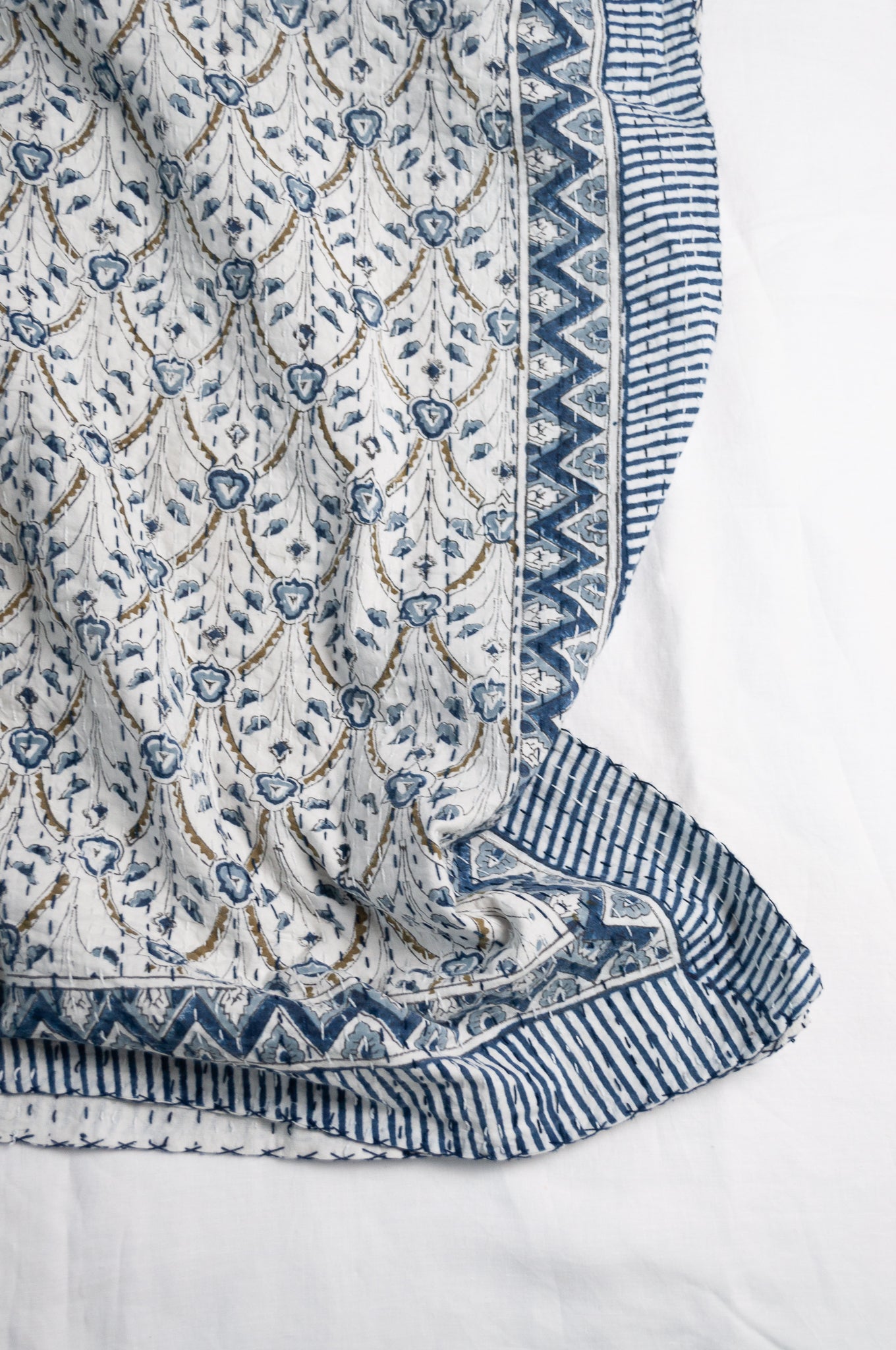 Blue and white floral blockprint cotton kantha quilt.
