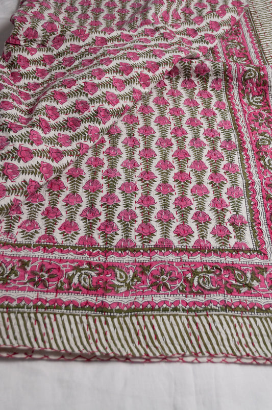 Pink green and white floral cotton kantha quilt.