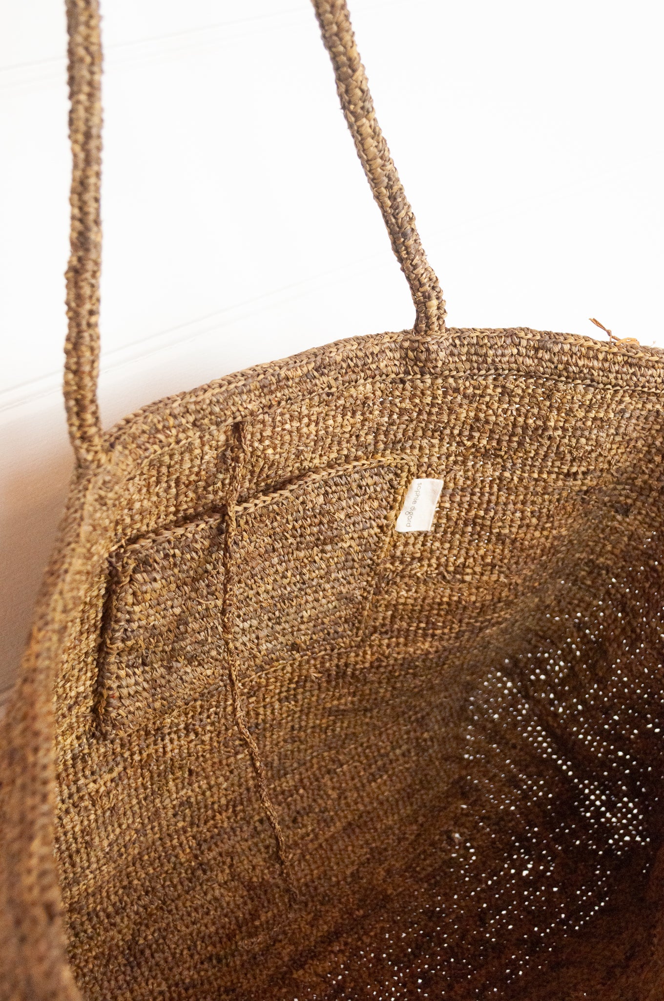Sophie Digard crochet raffia bag, plain in shades of sand brown.