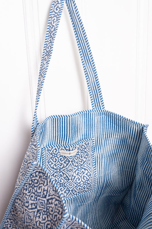 Blue and white quilted tote bag.