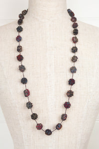 Classic handmade Sophie Digard necklace is a string of embroidered fabric beads, in a cool winter palette, Dingle.