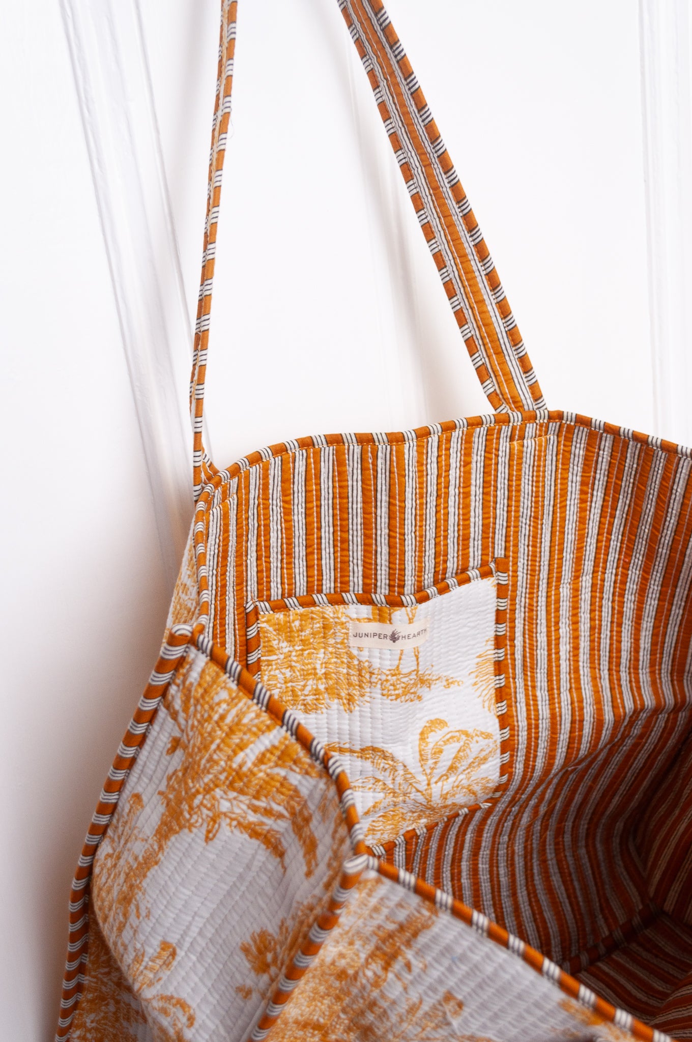 Mustard yellow and white toile de jouy quilted tote bag.