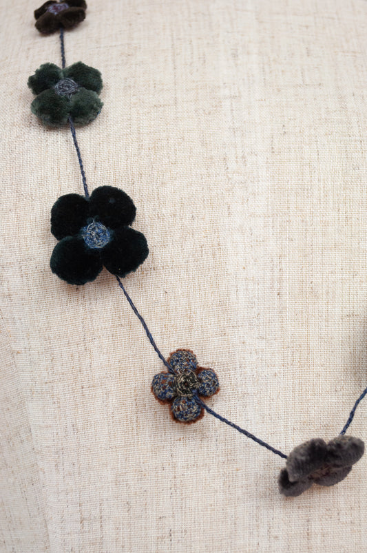classic Sophie Digard handmade embroidered necklace is a string of beautiful velvet flowers, backed with linen embroidery in shades of chocolate brown, steel blue and deep olive green..