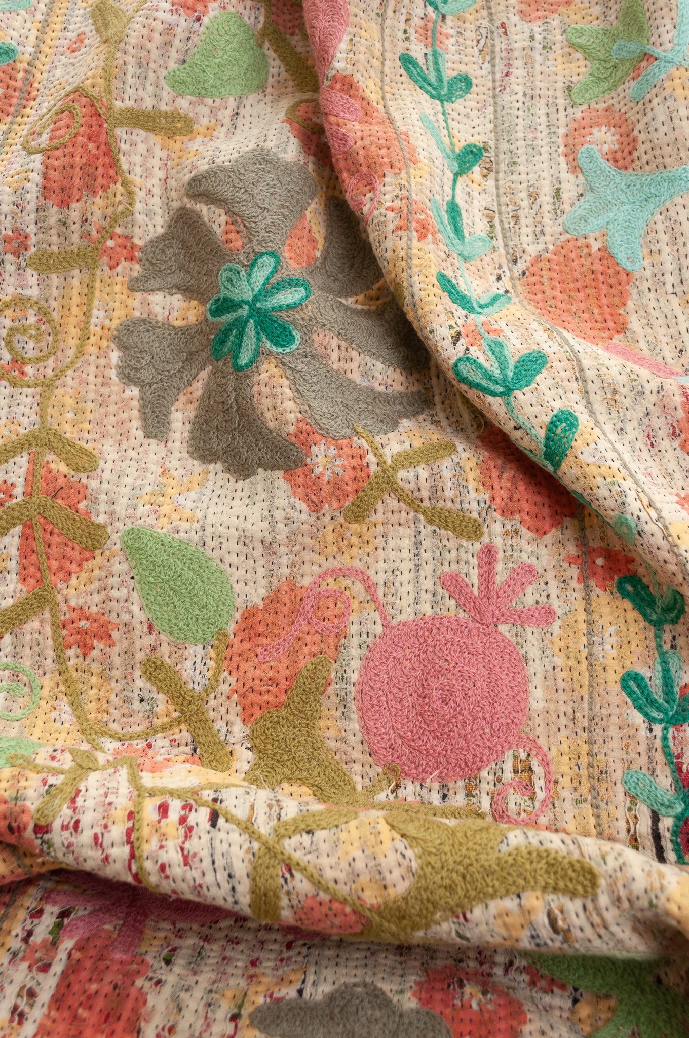 Suzani embroidered vintage kantha quilt floral design in pink, teal, aqua and mustard.