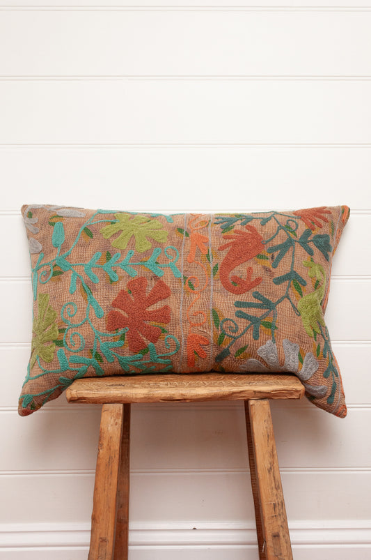 Suzani embroidered vintage kantha quilt cushion, floral design aqua, lime, rust and teal on sepia brown base.