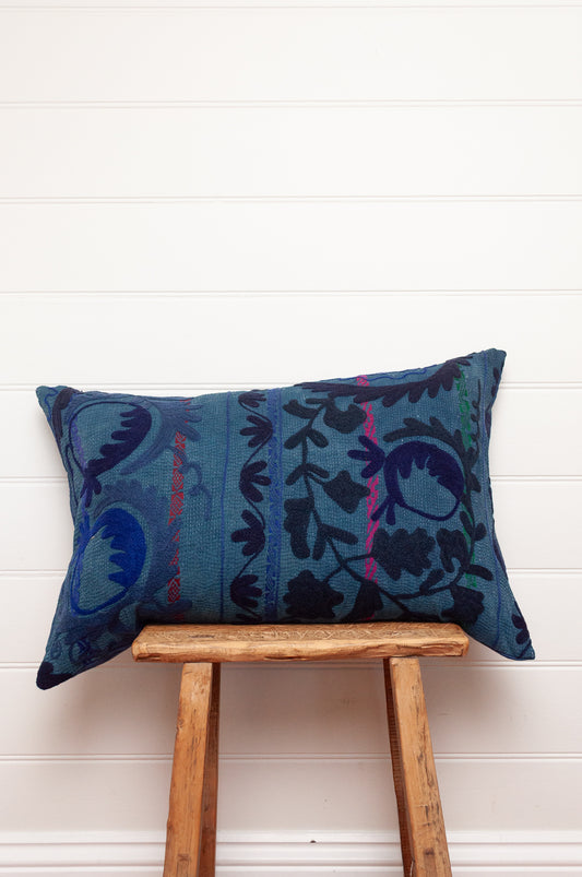 Suzani embroidered vintage indigo quilt, floral design in deep indigo and cobalt blue on indigo base with red highlights.