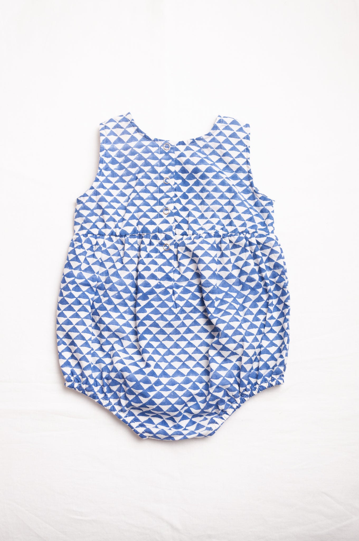 Juni Kids pure cotton blockprint baby romper in cobalt blue triangles on white.