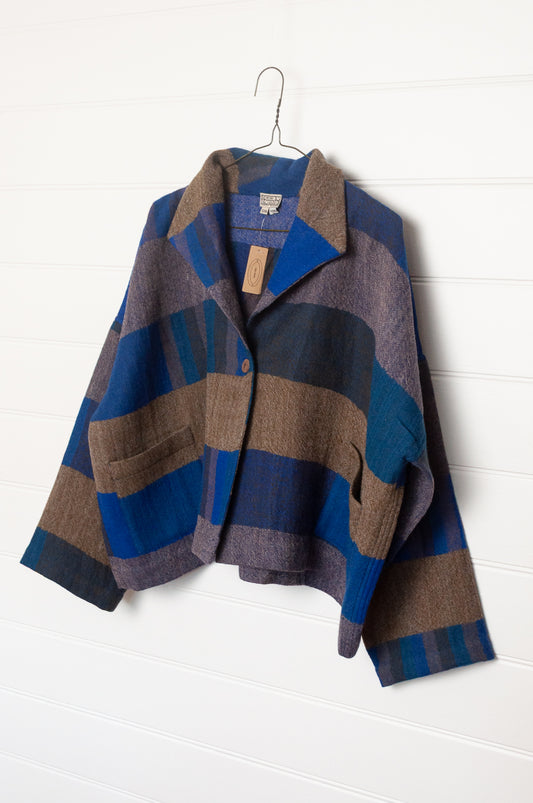 Neeru Kumar handwoven wool Coco jackt in block blanket checks in grey brown, cobalt, teal and navy.