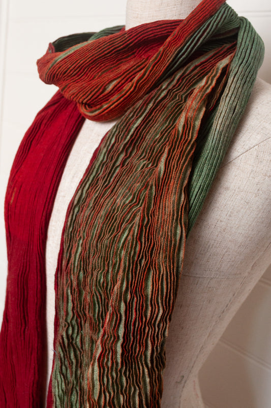 Neeru Kumar pure wool shibori dyed crinkle pleat finish scarf in ruby red and aquamarine blue.
