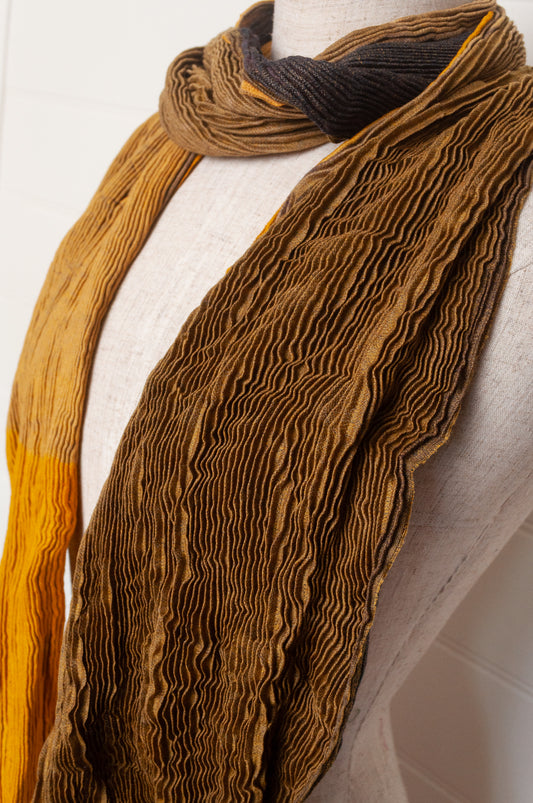 Neeru Kumar pure wool shibori dyed crinkle pleat finish scarf in gold and brown.