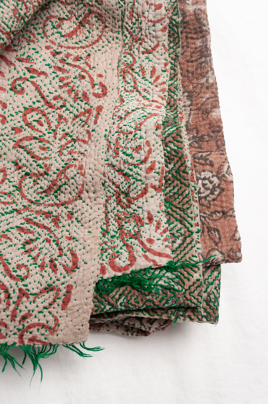 Vintage kantha quilt Bagru blockprinted in brown, floral design with green braid edging embroidery.