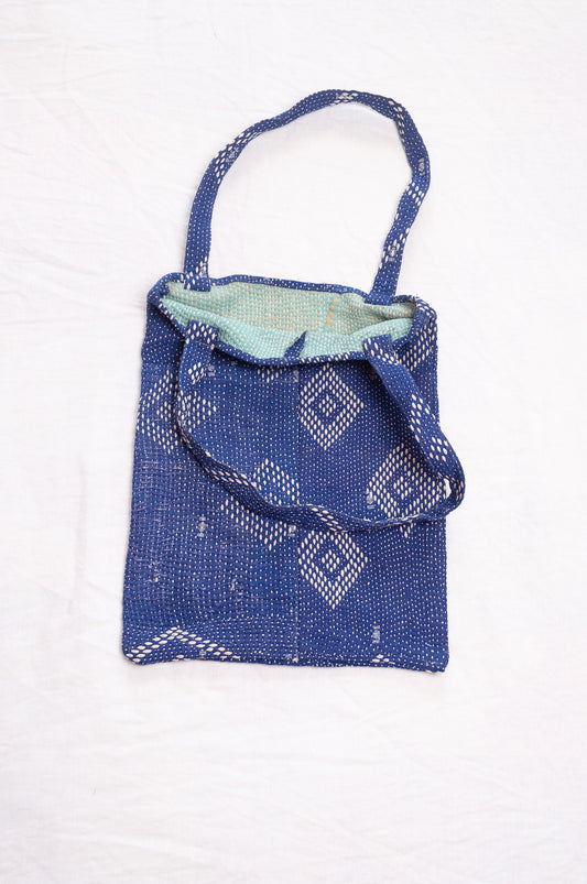 Vintage embroidered kantha quilt tote bag in sapphire blue.