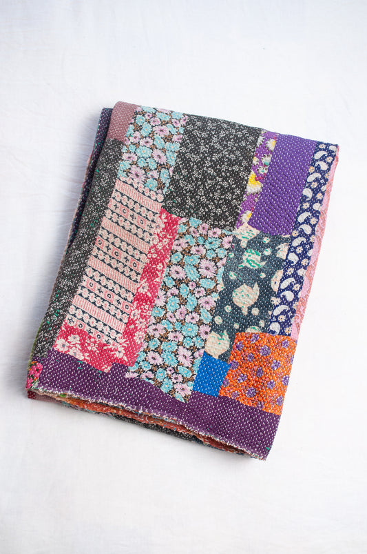 Striped patchwork kantha quilt featuring retro floral prints and plain colours.