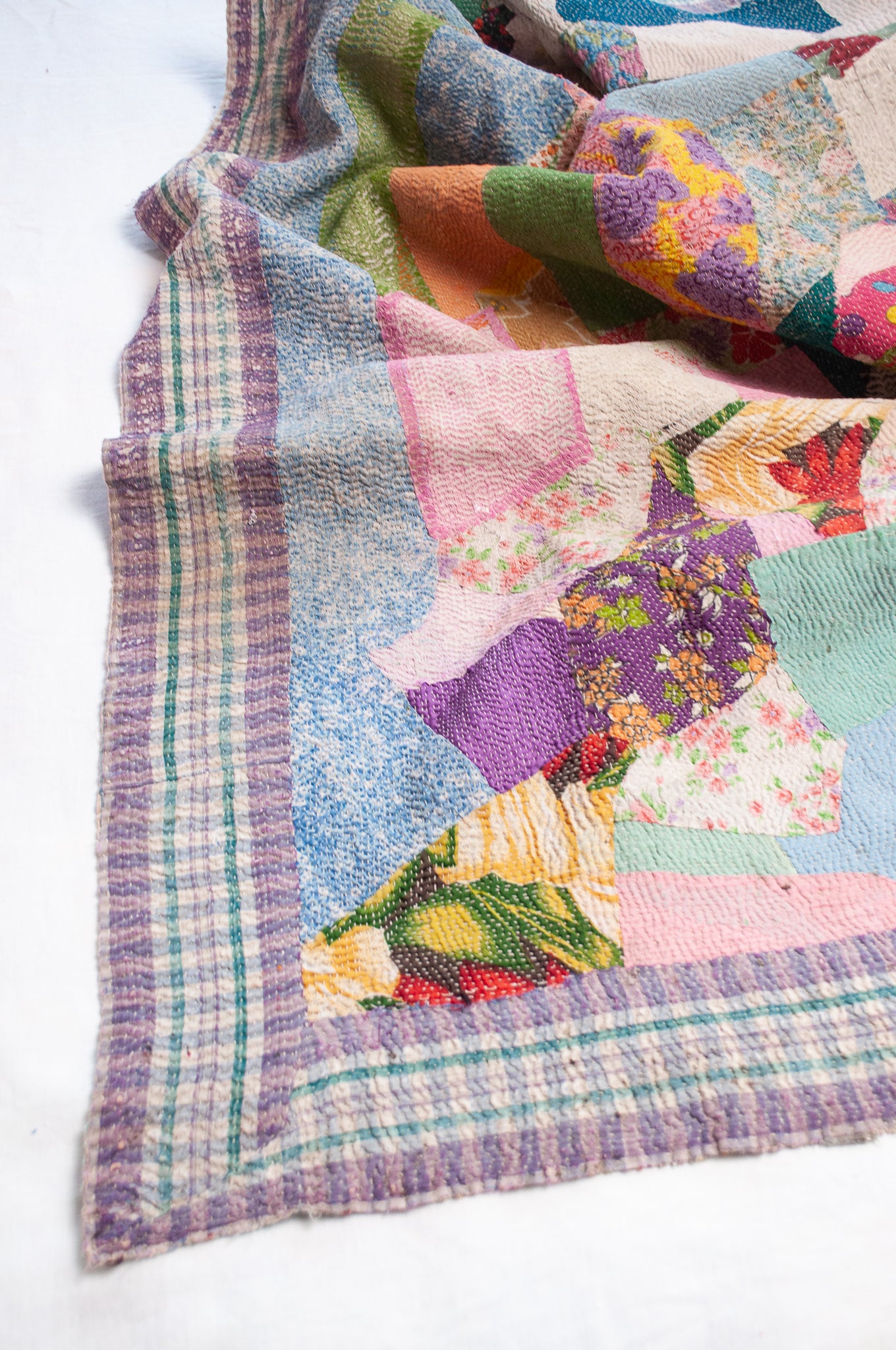 Crazy patchwork kantha quilt in retro prints and plains.