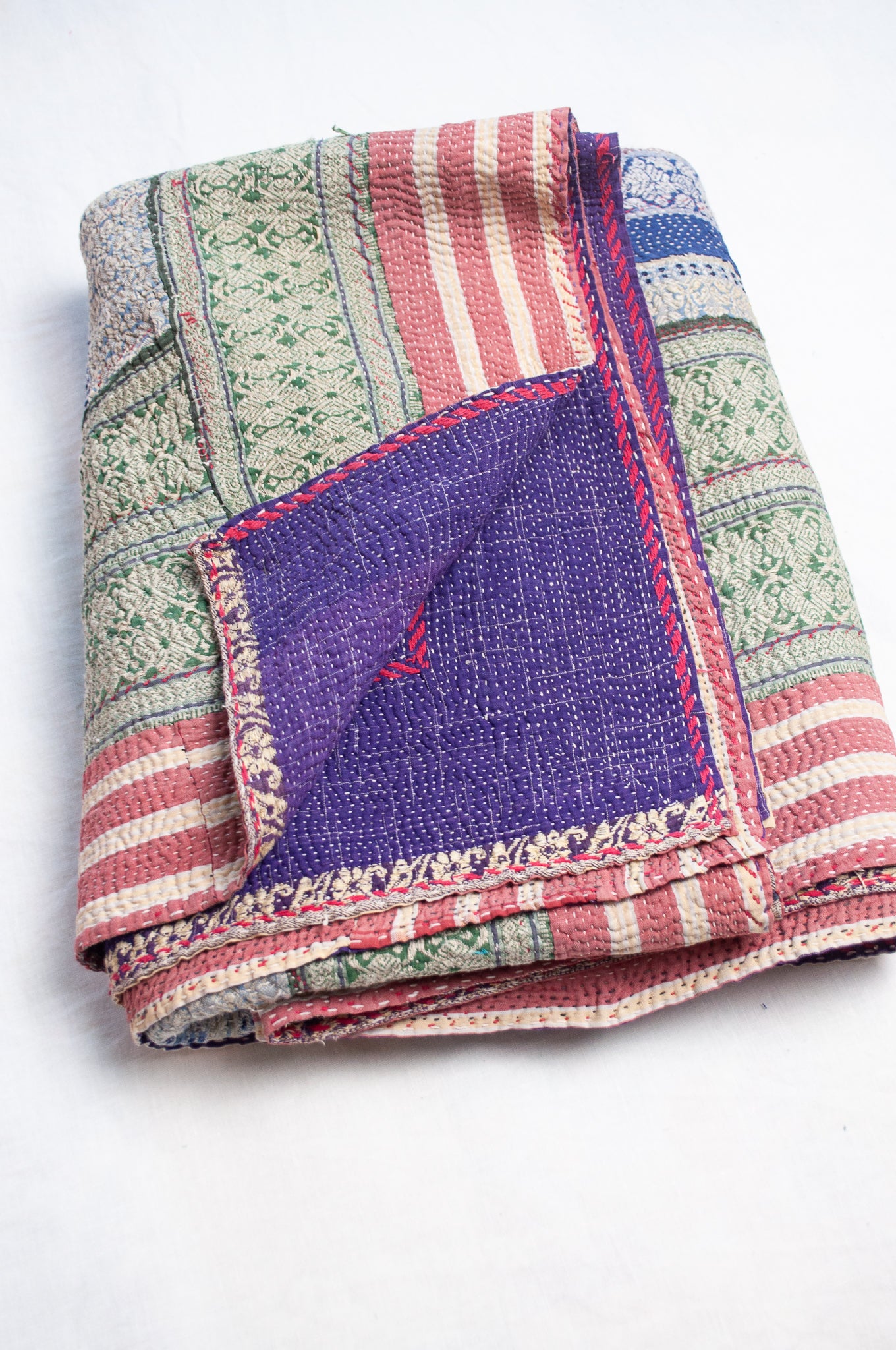 Multi striped coloured vintage kantha quilt.