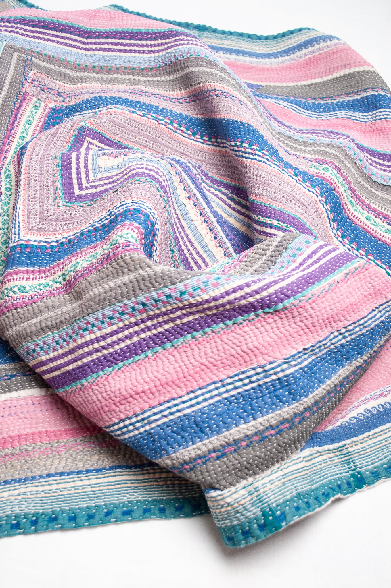 Striped vintage kantha quilt in pink, blue, grey and green.