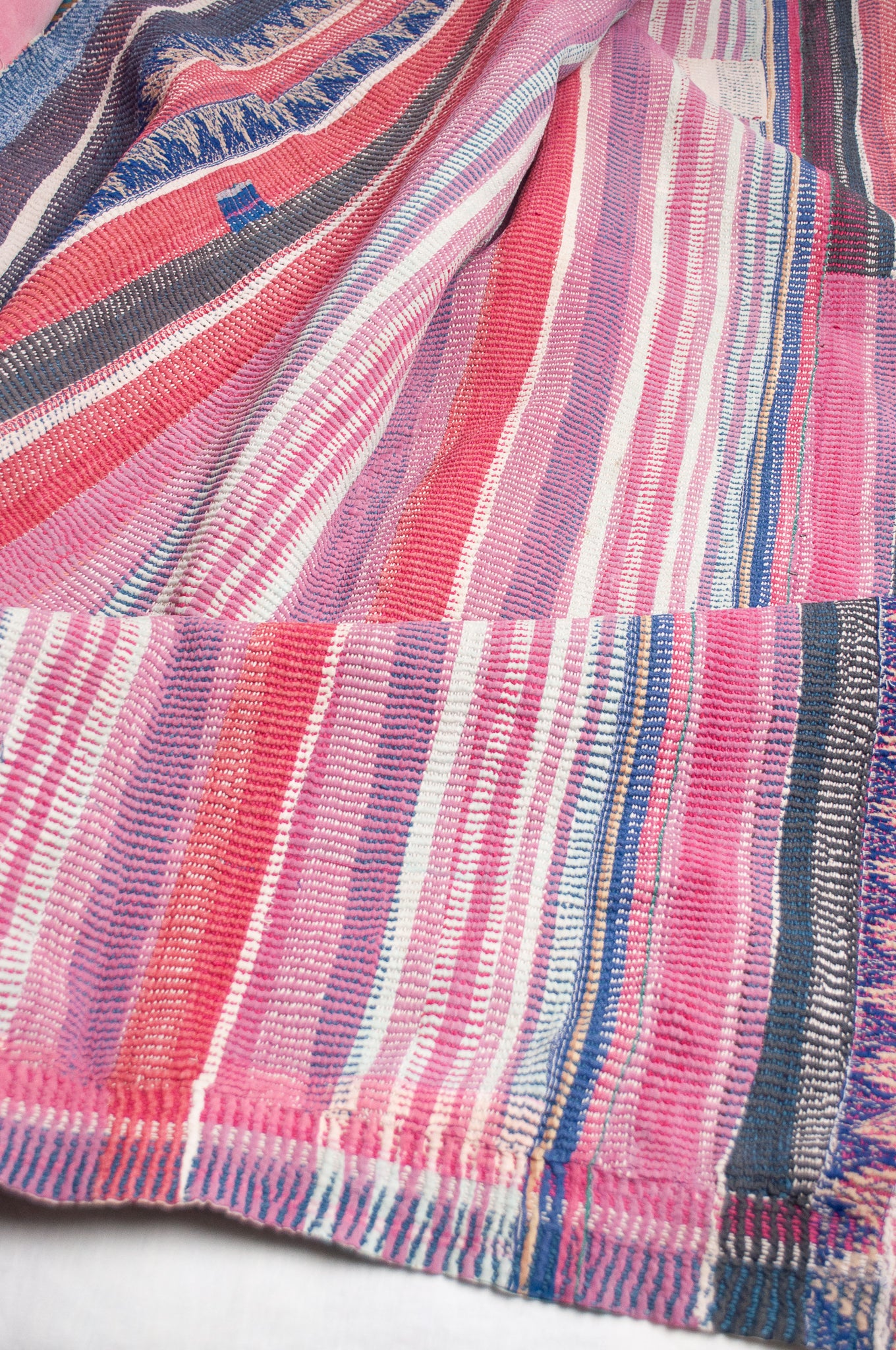 Striped vintage kantha in pink, white, green and blue.
