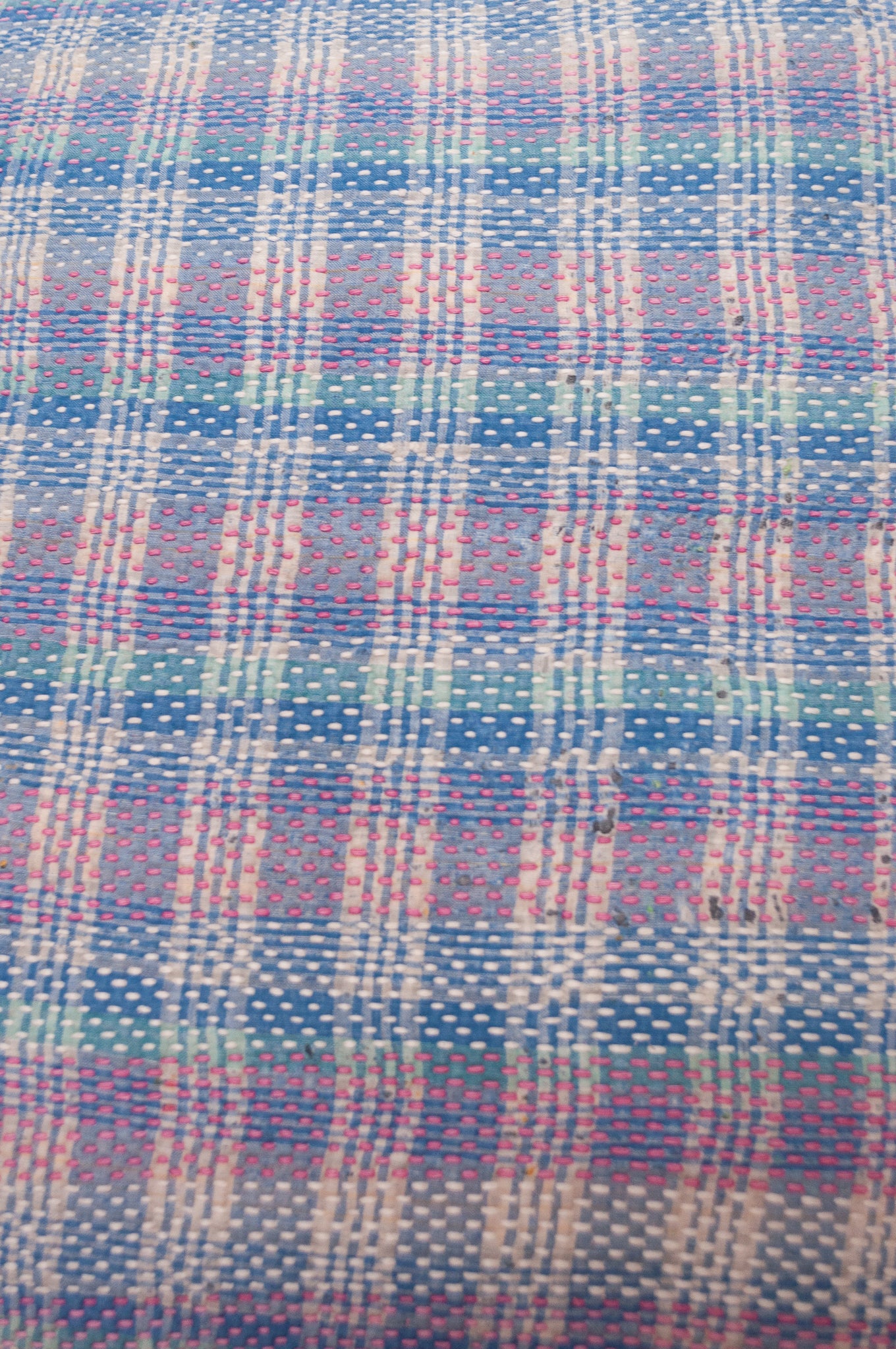 Vintage kantha quilt cushion in blue and lavender plaid.