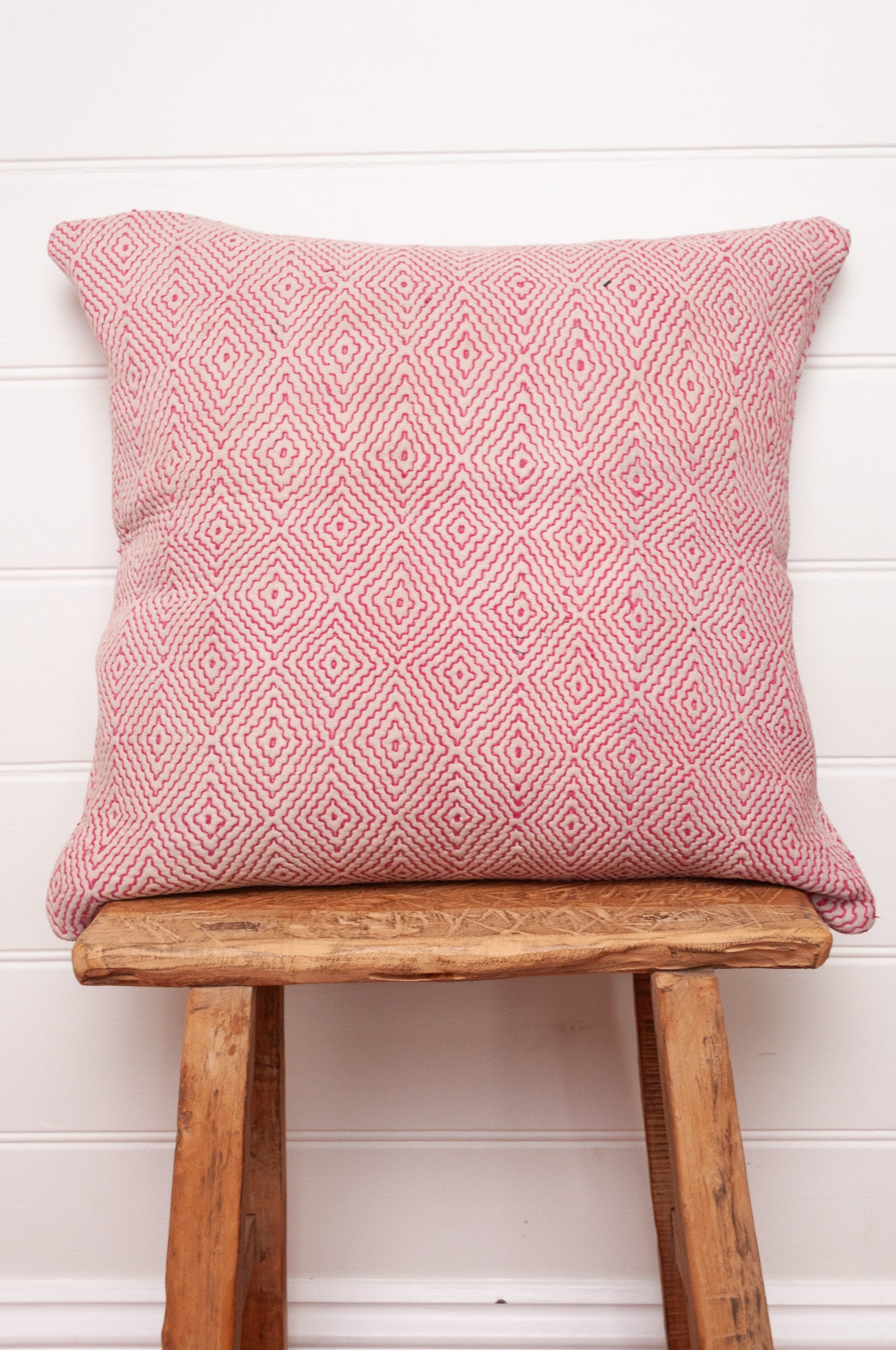 VIntage kantha quilt cushion embroidered red diamonds on white.