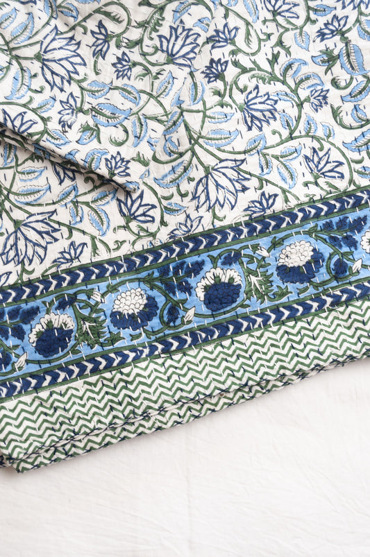 Kantha quilt blockprint pure cotton in floral blue and green on white pattern.