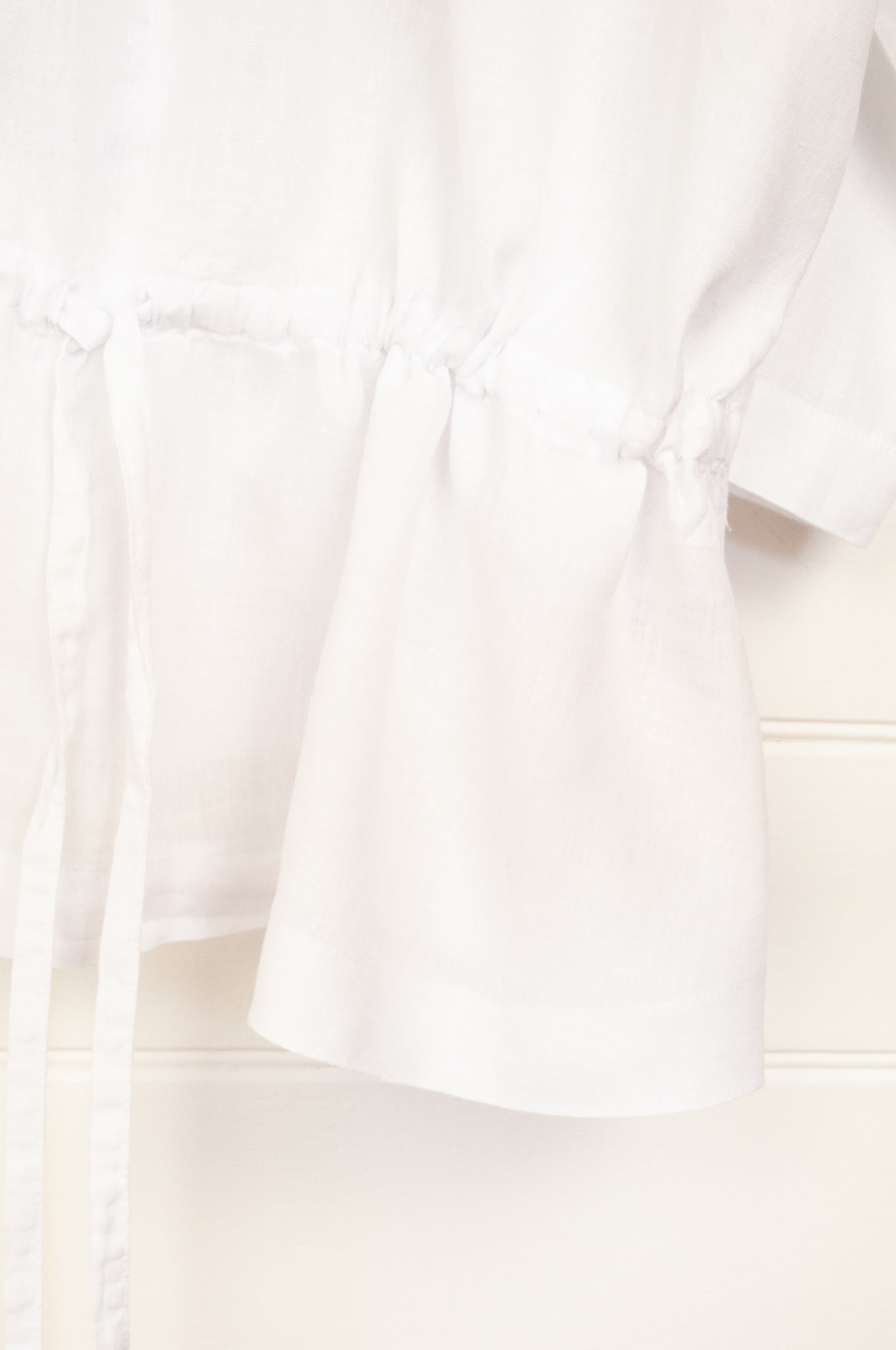 Banana Blue made in Melbourne white linen top with peplum tie.