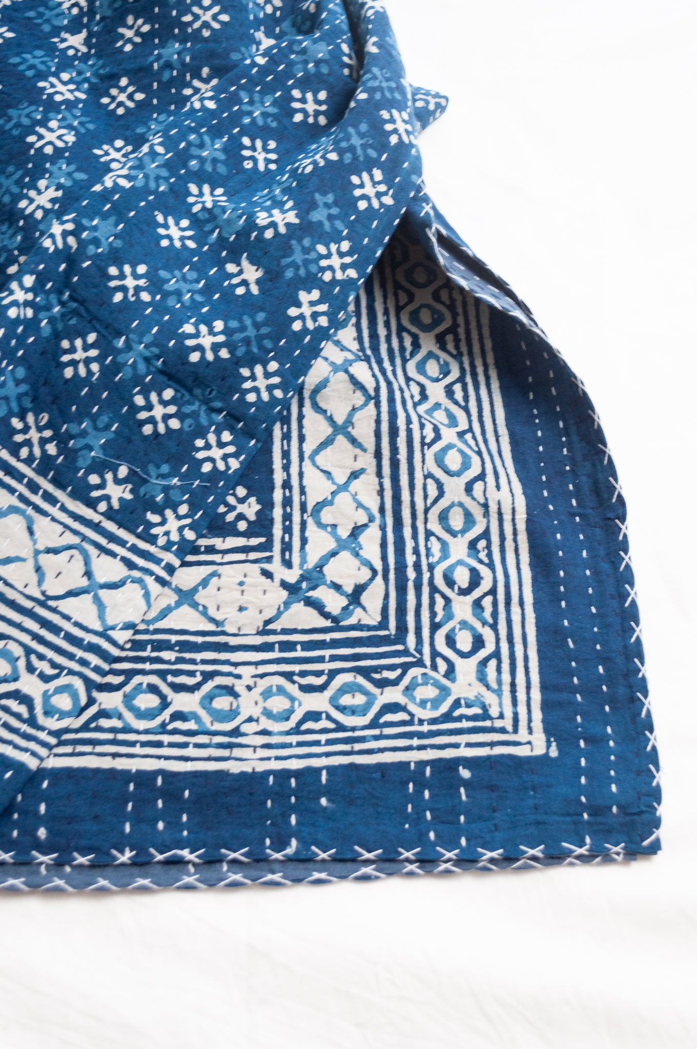 Indigo blue and white pure cotton kantha stitch bed quilt with diamond dot design.