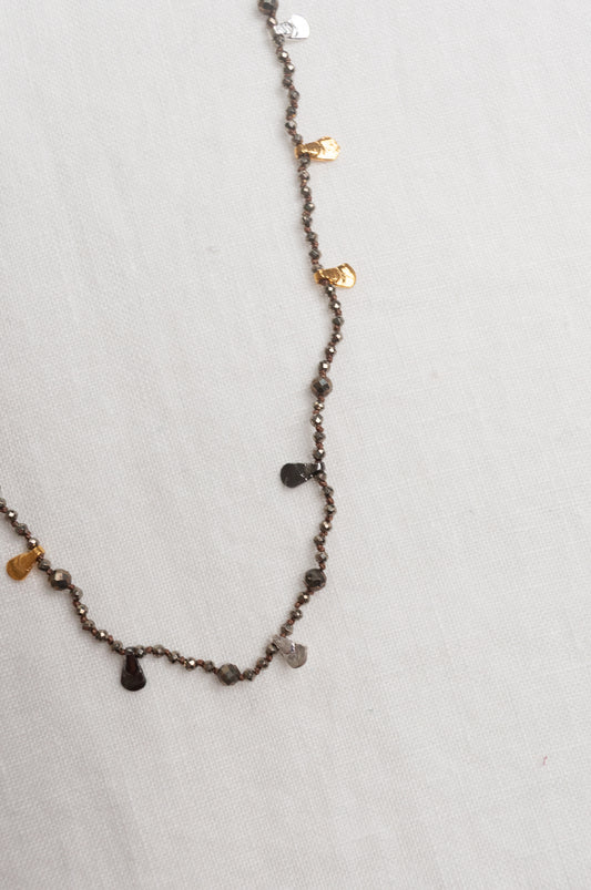 Mary Gaitani handmade pyrite necklace with silver and gold charms.