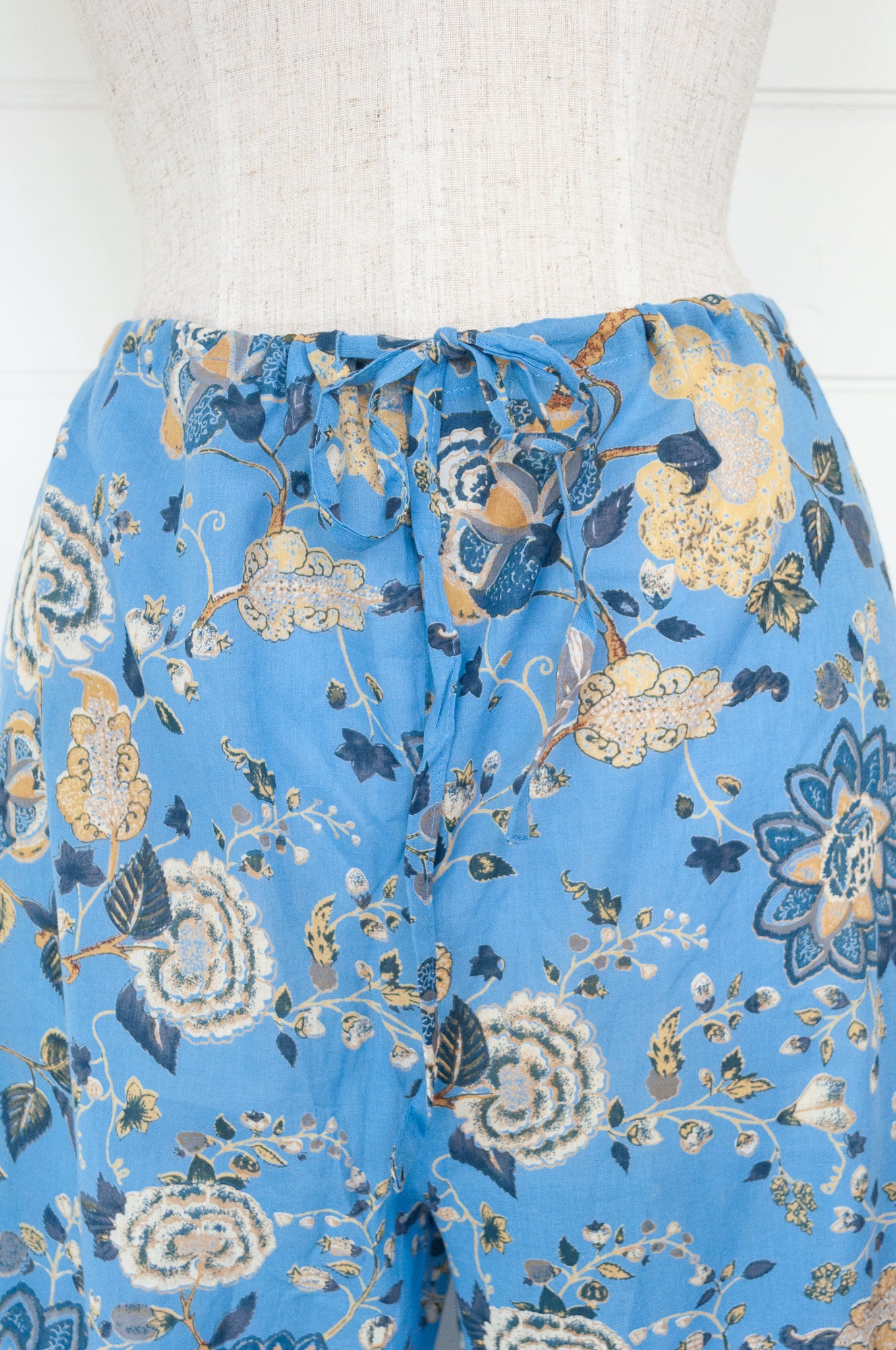 Juniper Hearth cotton voile pyjamas in Magenta sky floral print on sky blue.